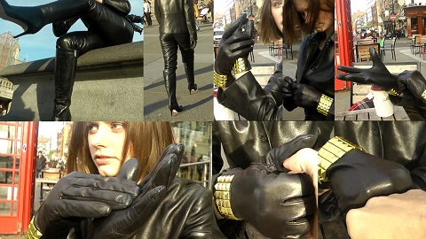 girl with brown hair wearing black leather gloves and a leather jacket